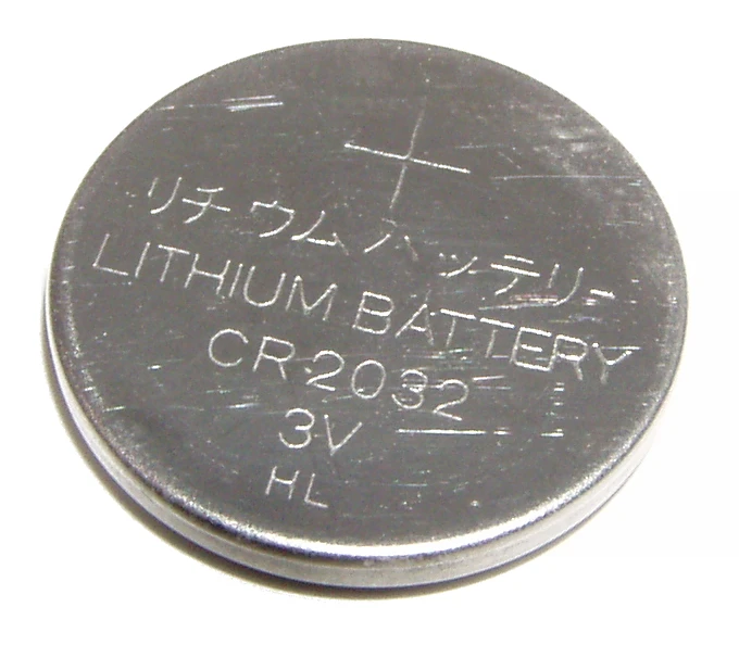 A silver CR2032 3 volt lithium coin battery with the plus sign and size code stamped on its face.